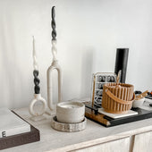 Boulder concrete candle styled on a shelf