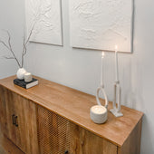 Gem and Boulder concrete candles styled on a wooden sideboard